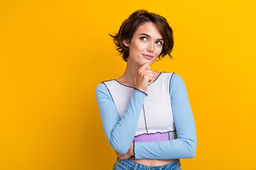 Photo of dreamy adorable lady dressed shirt arm chin looking empty space isolated yellow color...