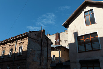 Charming architecture juxtaposes old and new in Lviv, Ukraine under a brilliant blue sky