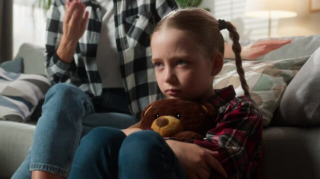 Family problem misunderstanding conflict adopt custody quarrel Caucasian sad stressed child kid daughter girl frustrated suffering domestic psychology violence close ears angry mother woman yelling