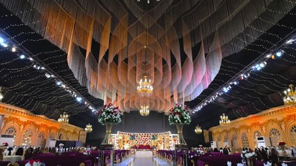 Grand Ballroom Interior: A captivating image unveils the elaborate interior of a grand ballroom, resplendent with opulent decorations, inviting attendees to indulge in the celebration of joy.