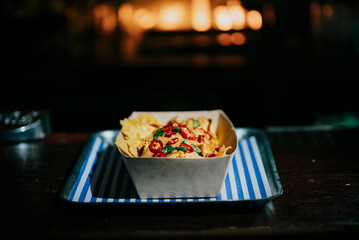 A tray of nachos sits on a table