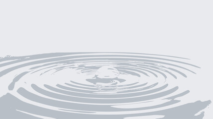Close-up macro shot of a water droplet impacting a flat surface, creating concentric ripples. The image is predominantly white and gray, showcasing the texture and pattern of the water's movement.