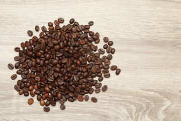 Coffee beans on wooden background