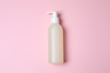Natural cosmetic products. Cosmetic bottle on a pink background, top view