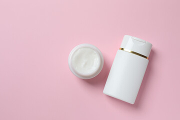 Natural cosmetic products a pink background, top view