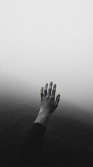 Reaching into the Mist: An arm extends, hand outstretched, into a dense, atmospheric fog, symbolizing longing and isolation with a touch of mystery.