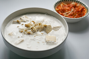 Bean sprouts in coconut milk and a spicy mango relish, a typical food eaten with white rice for...
