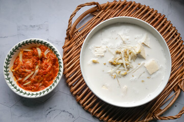 Bean sprouts in coconut milk and a spicy mango relish, a typical food eaten with white rice for lunch or dinner in Malaysia.