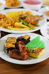 Assorted traditional Indonesian cakes, captured on April 8, 2025. Colorful and sweet treats made with local ingredients, perfect for festive moments and everyday enjoyment