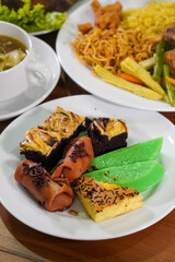 Assorted traditional Indonesian cakes, captured on April 8, 2025. Colorful and sweet treats made with local ingredients, perfect for festive moments and everyday enjoyment