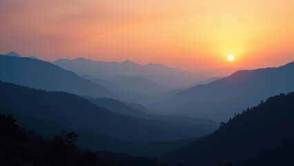 Fototapeta premium A dramatic sunset illuminates a mountainous landscape with a clear view of a wildfire in the distance.