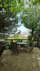 cozy place to relax in nature, wooden table and benches in the forest
