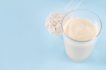 Quick and simple protein pudding. Healthy summer cold dessert. Three glasses with vanilla, chocolate and berry protein pudding, with chocolate slices, fresh strawberry, blueberry, protein powder scoop