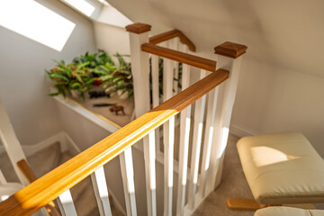 Newly completed attic conversion for a single storey house in the UK. Showing part of a foot stool...