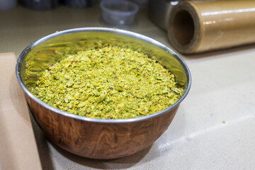 Ground Pistachios in a Metal Bowl