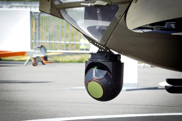 Camera sensor pods under an aerial surveillance helicopter © VanderWolf Images