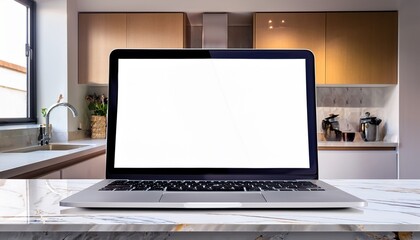 close up of a laptop with white blank mock up screen on a marble table with a modern home kitchen in the background
