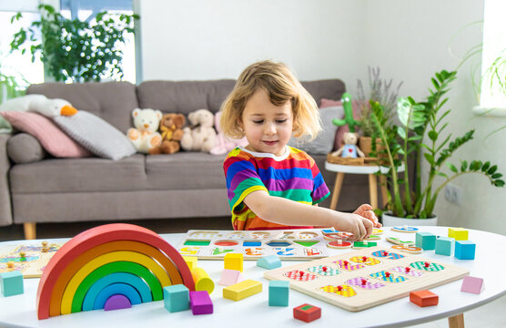 Child learns numbers and letters. Selective focus.