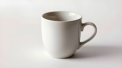 A simple, elegant white mug, perfect for a quiet morning, a warm beverage, and peaceful contemplation against a bright, minimalist background.