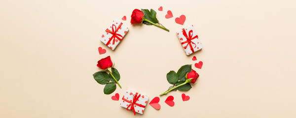 Heart made of rose, git box, heart and blank greeting card mockup on Colored background. Top view, flat lay, copy space Holiday, Mothers Day, birthday concept