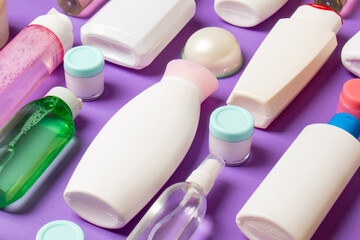 Group of plastic bodycare bottle Flat lay composition with cosmetic products on colored background empty space for you design. Set of White Cosmetic containers, top view with copy space