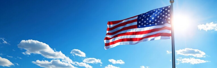 Obraz premium American Flag Waving in the Breeze Against a Beautiful Cloudy Sky in Full Detail