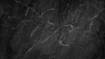 a smooth, dark black marble surface with a captivating pattern of delicate, intertwining gray veins, creating a luxurious and elegant backdrop that exudes natural beauty and sophistication.