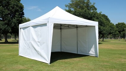 Elegant white pop up canopy tent on a lush green grass field, perfect for outdoor events