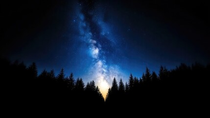 Fototapeta premium Milky Way over a dark forest. Silhouettes of trees against a vibrant night sky filled with stars and the Milky Way galaxy. A breathtaking celestial display