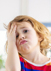 Fototapeta premium The child has a headache. Selective focus.