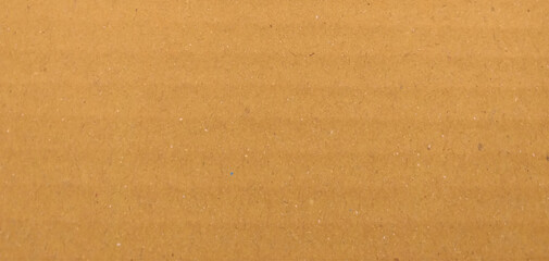 Background of brown kraft paper or cardboard texture. Abstract pattern of beige rough carton, old paper sheet, 