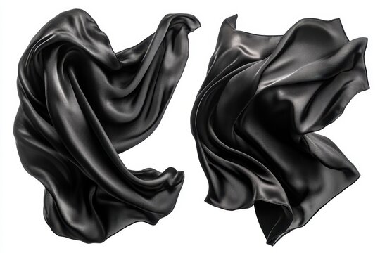 Elegant black silk fabric floating gracefully against a pristine white background capturing dynamic movement and luxurious texture with a clean studio shot