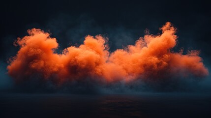 Fototapeta premium Fiery orange smoke billows in a dark scene