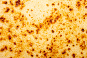 The texture is pancake.Russian pancakes with a ruddy crust.Pancakes background.Pancakes top view.