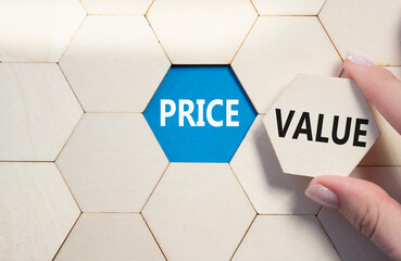 Price and Value symbol. Concept word Price and Value on wooden comb puzzle. Businessman hand....