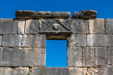 Details of a window of the ancient Bar'am Synagogue in Bar'am National Park in northern Israel near...