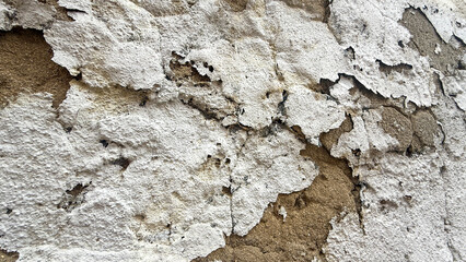 Aged white peeling paint on textured wall, urban decay, vintage renovation, textured surface background, retro architecture