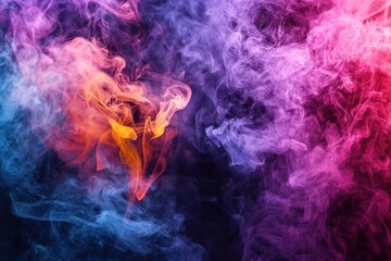 Fototapeta premium An ethereal and mesmerizing display of swirling, colorful smoke against a dark backdrop, creating a dreamy and abstract visual experience for the viewer.