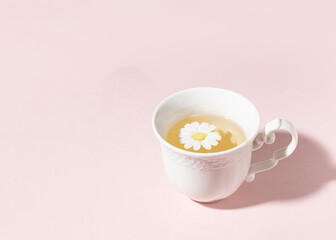 A cup of floral tea with spring flower