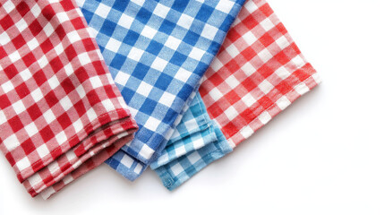 Fototapeta premium The tea towels, with their vibrant colors and simple patterns, are neatly folded to form a pleasing composition.