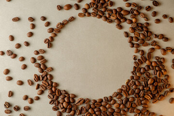 Creating art with coffee beans on a rustic surface at dawn