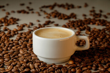 Rich espresso nestled among aromatic coffee beans in a cozy setting