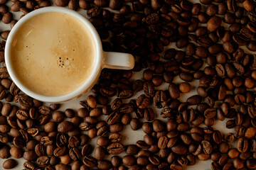 Rich coffee atop a bed of roasted beans in an inviting morning atmosphere