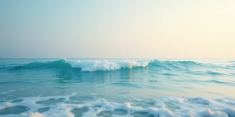 Fototapeta premium Serene Ocean Wave at Dawn A Peaceful Coastal Scene of Gentle Turquoise Waters and White-Capped Surf
