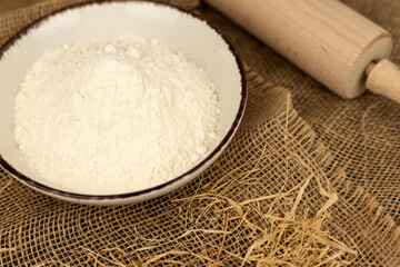 Flour and rolling pin view from above. Rustic style. Baking at home