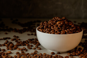 Coffee beans overflow from a white bowl, creating a savory treat