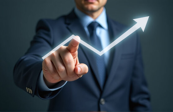 Businessman Touches Arrow Pointing Downwards, Stimulating The Economy With A Low Price That Encourages Market Demand To Decrease.