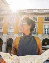 Tourist exploring lisbon using map enjoying summer holidays in portugal