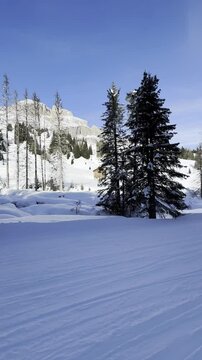 Vertical Shot of Italian Landscape in Motion and covered by Snow in Ski Resort. Outdoor Scenery in Dolomites Superski in Northeastern Italy.