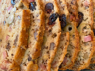 Close-up of an olive cake with a golden crust and moist texture, perfect as a food-themed background